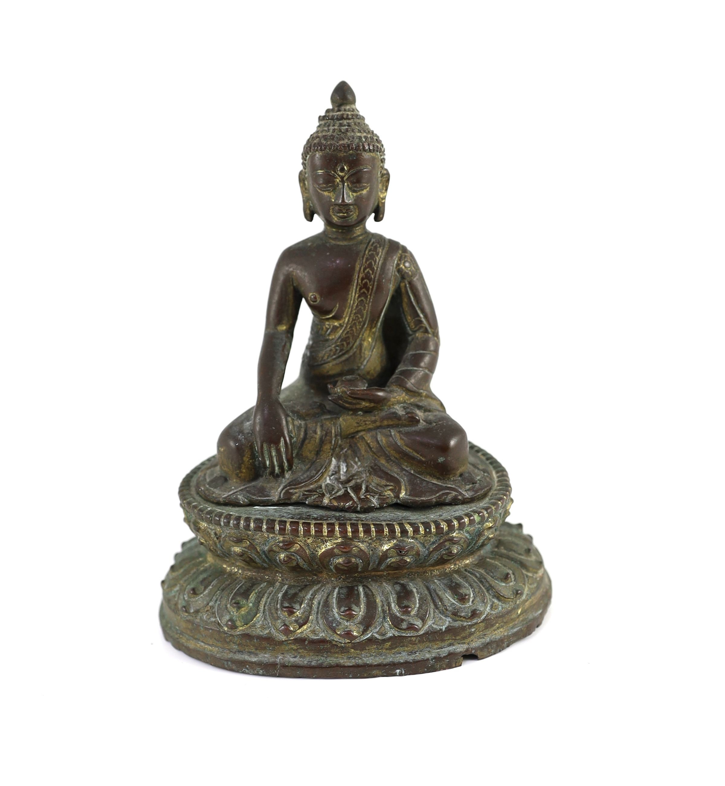 A Nepalese or Tibetan gilt copper alloy figure of Buddha Shakyamuni, 18th/19th century, 15cm high